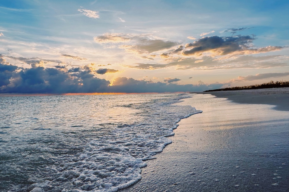waves washing up against the shore on a Marco Island beach